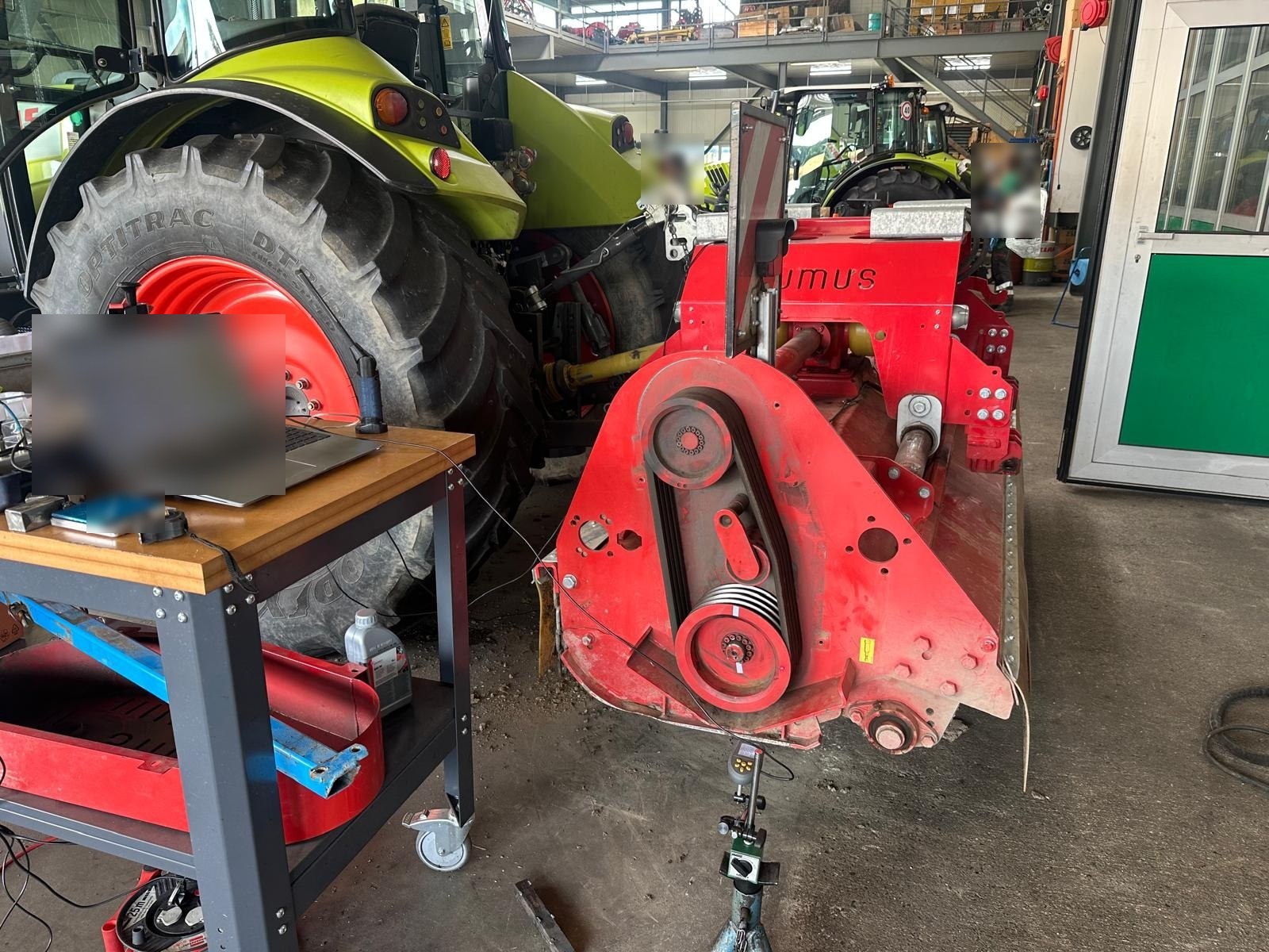 Balanset-1A measurement setup next to the mulcher: laptop and vibration sensors
